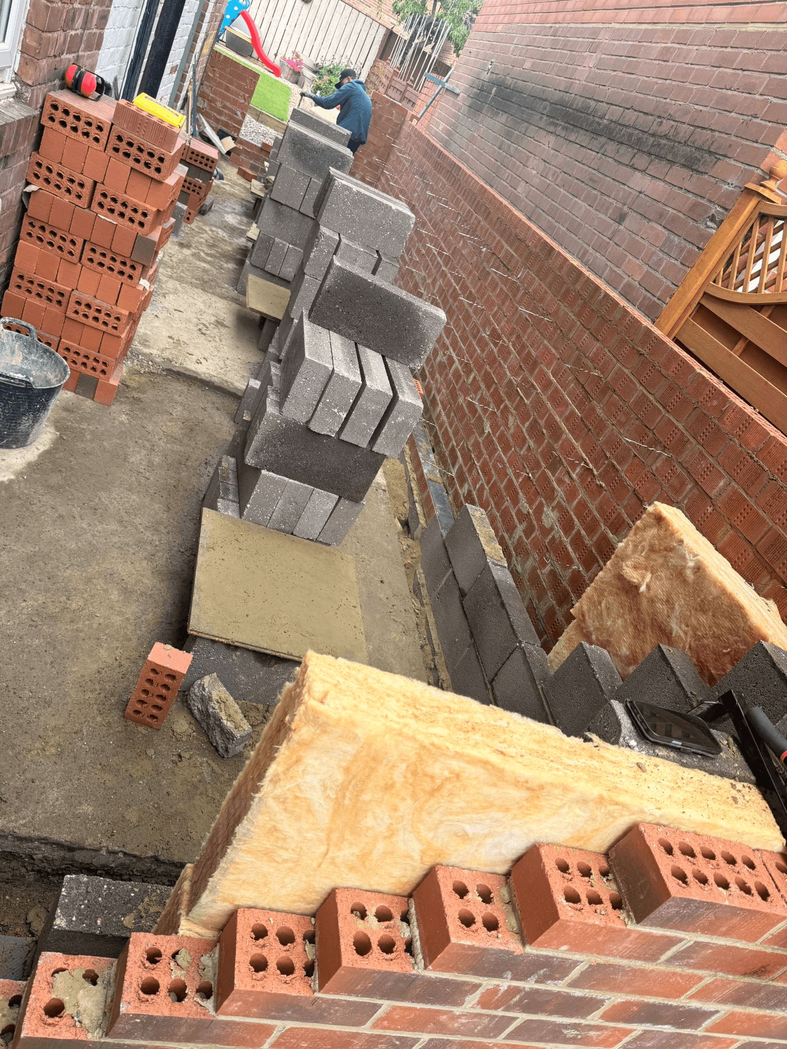 Wall being built with brick and block — Essential Home Improvement